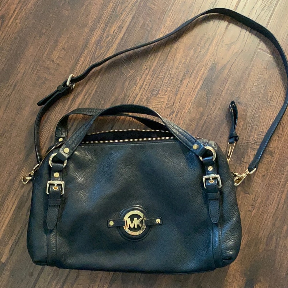 Michael Kors Crossbody purse. Black leather with gold tone hardware.